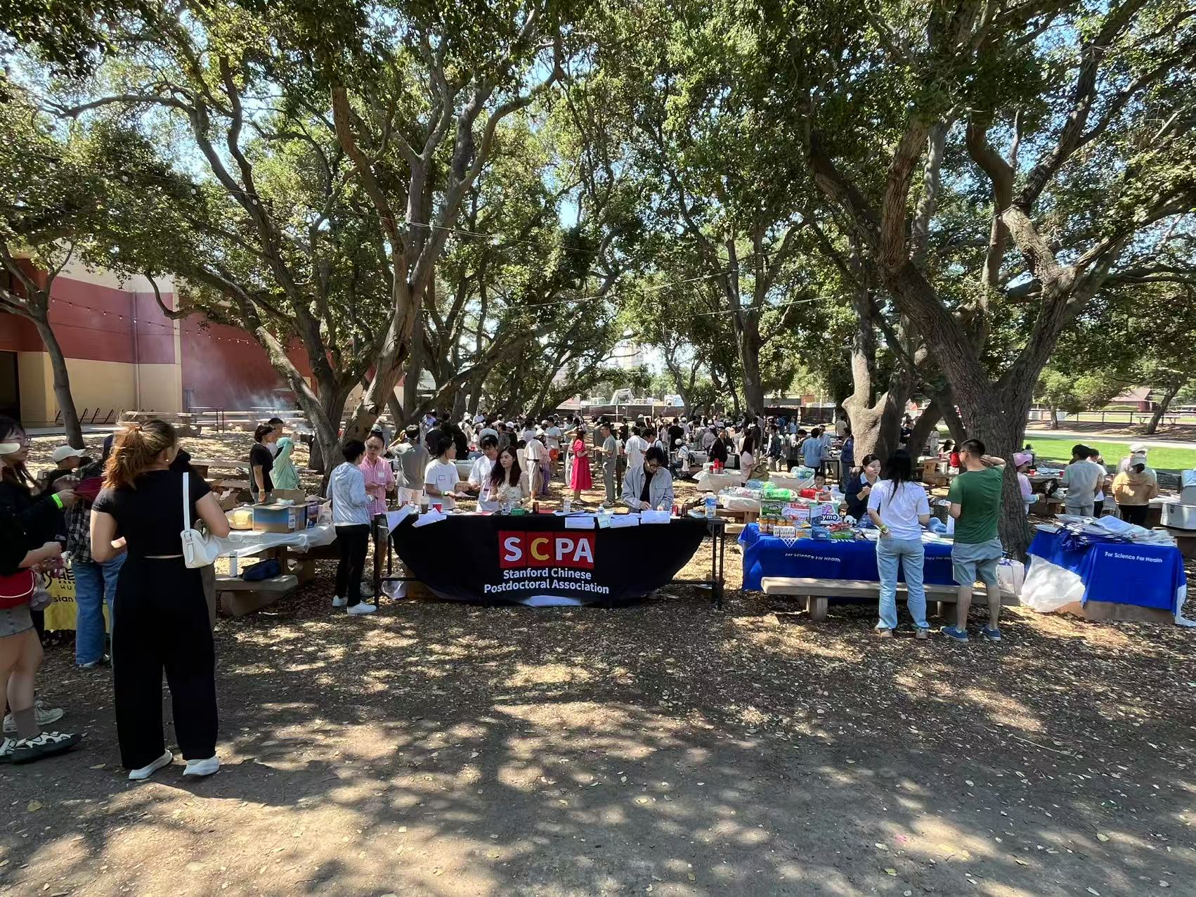 SCPA community members gathering at an outdoor barbecue