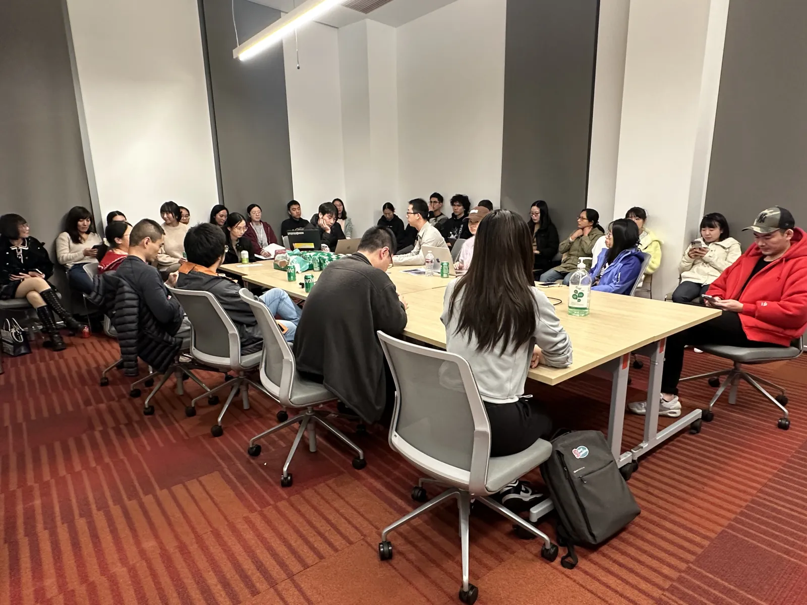 SCPA community members exchanging ideas around a conference table
